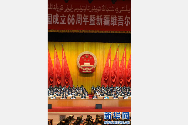 10月1日，慶祝中華人民共和國成立66周年暨新疆維吾爾自治區(qū)成立60周年大會在新疆人民會堂隆重舉行。 新華社記者 高潔 攝 