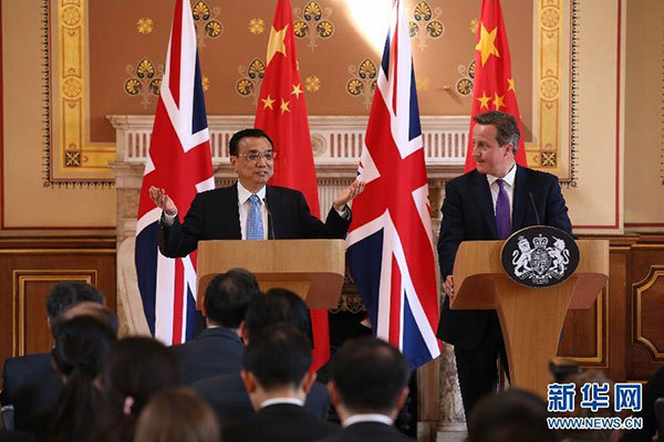     6月17日，國務院總理李克強同英國首相卡梅倫在倫敦舉行中英總理年度會晤后共同會見記者。 新華社記者 龐興雷 攝 